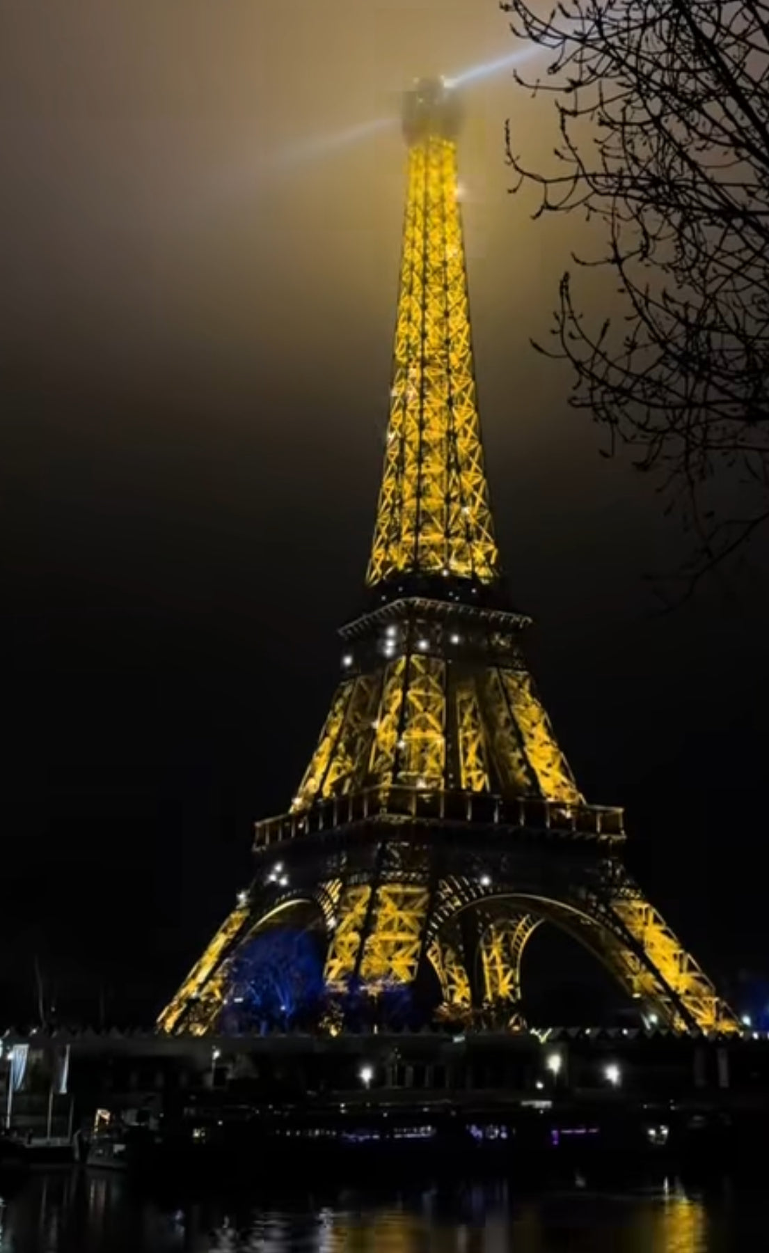 eiffel tower glowing in  the dark paris france