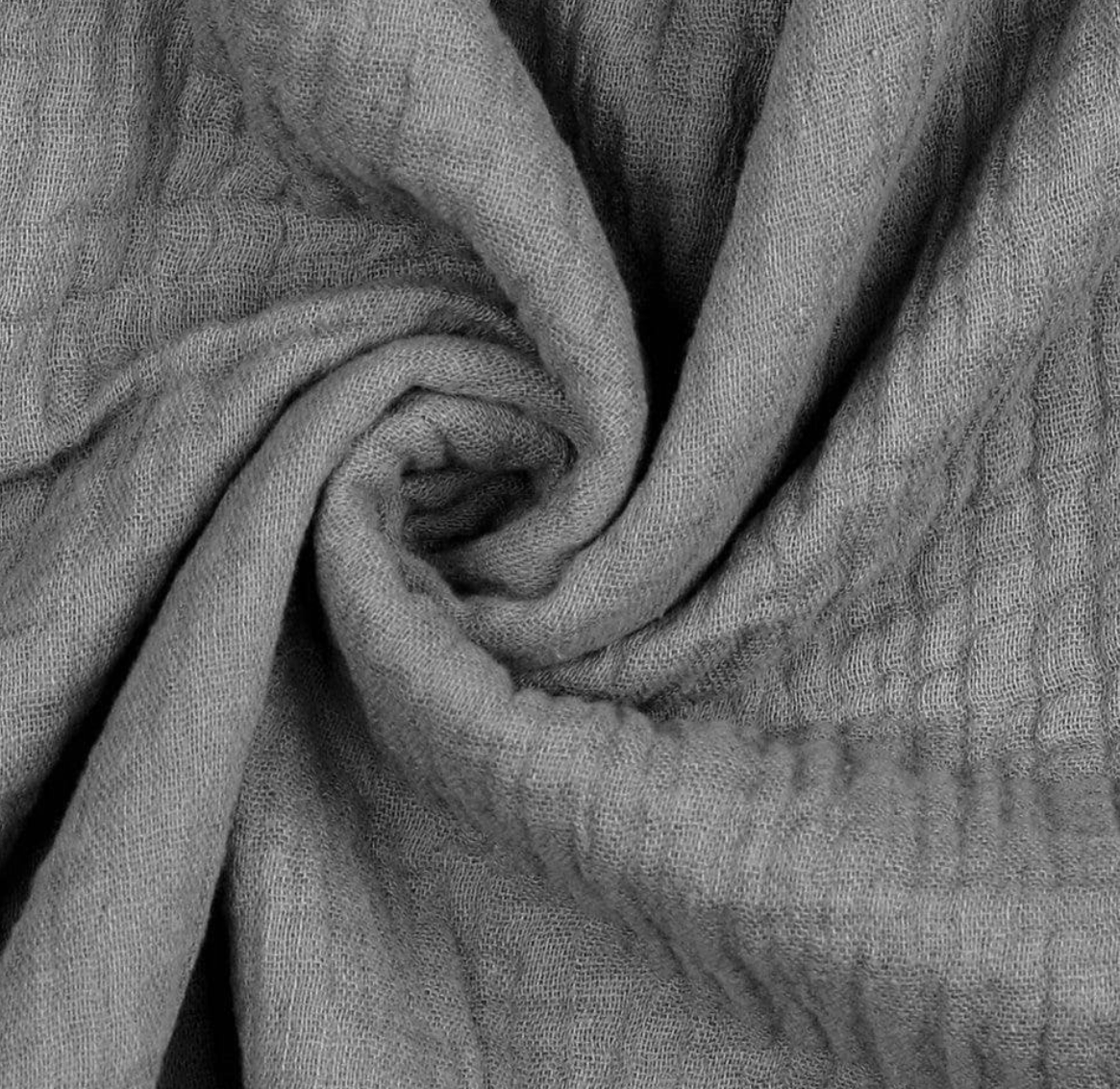 Close-up of textured gray muslin cotton scarf wrap with folds
